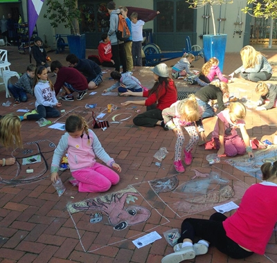 Kids turn pavement into art